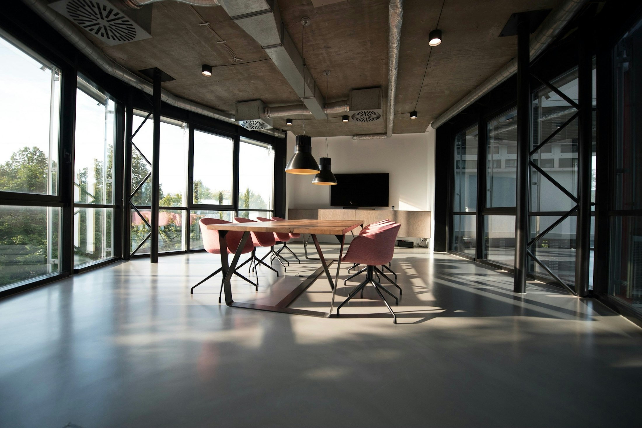 Bright modern office interior with glass walls and city view
