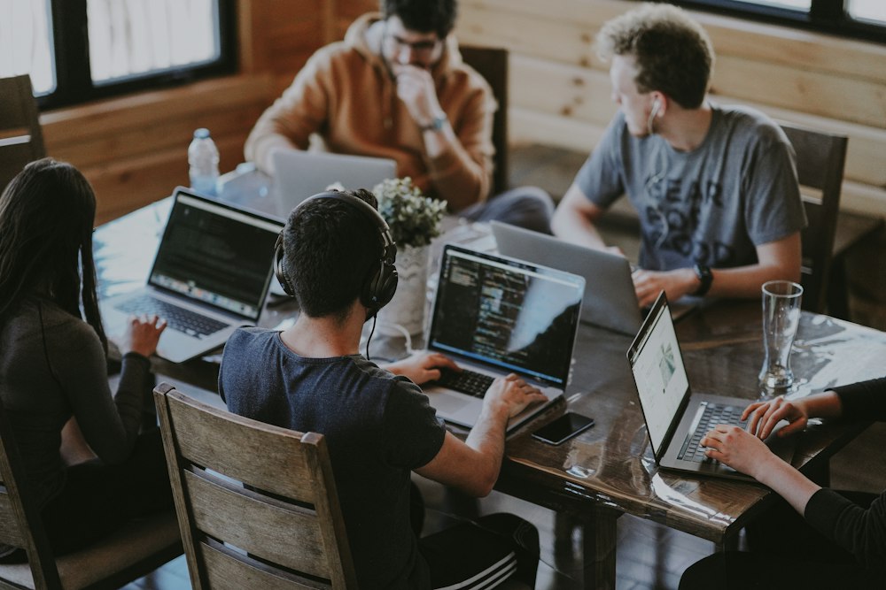 Consultants reviewing business data together in a bright office